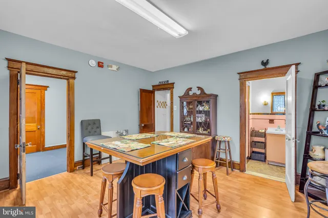 a view of a dining room with furniture and a table