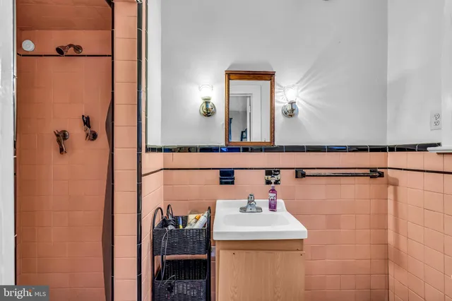 a bathroom with a sink and mirror