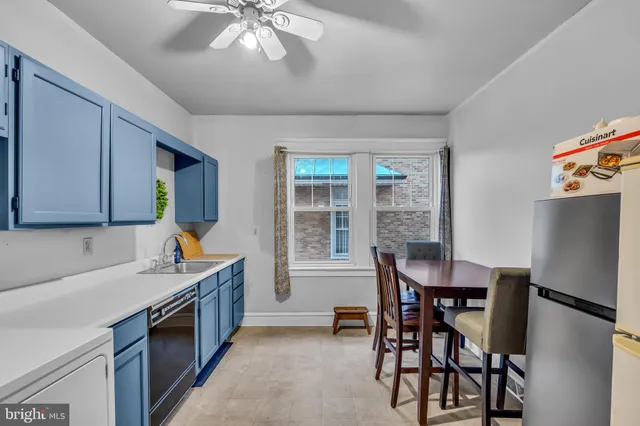 a kitchen with a sink cabinets and window