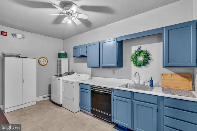 a living room with furniture a fireplace and next to a window