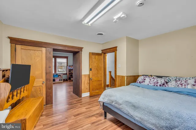 a living room with furniture and large windows