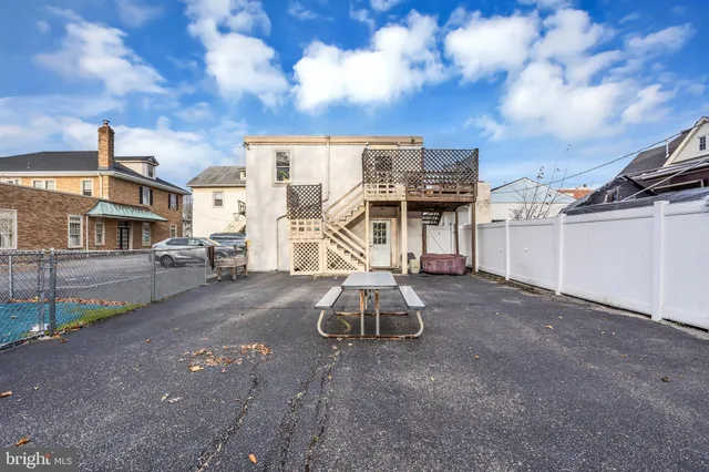 a view of a patio with a table and chairs