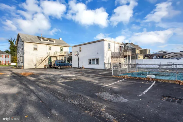 a view of street with parked cars