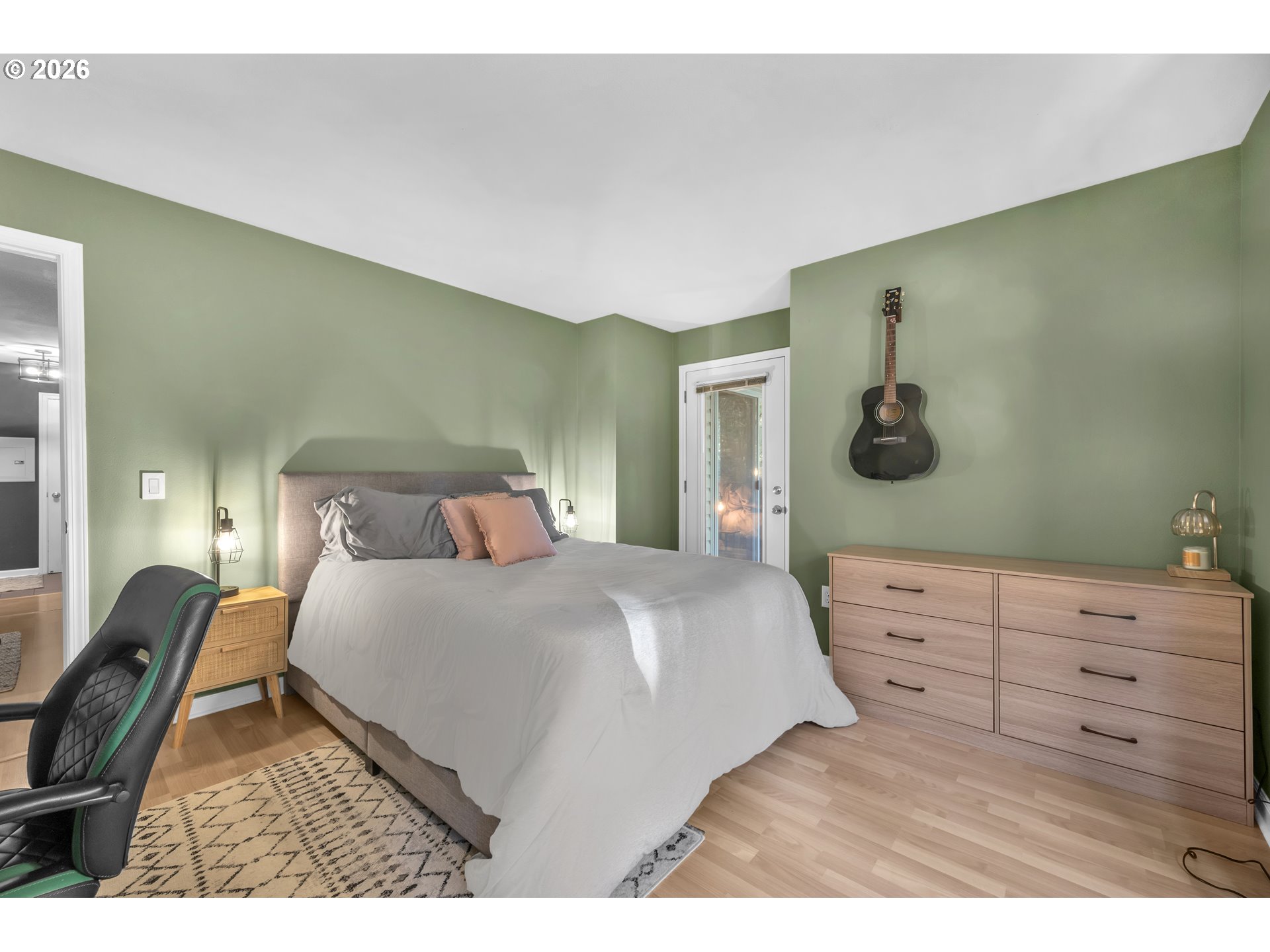 5142 Southwest Multnomah Boulevard, Unit H Portland, OR 97219 - Photo 24 of 26 a bedroom with a bed and a dresser