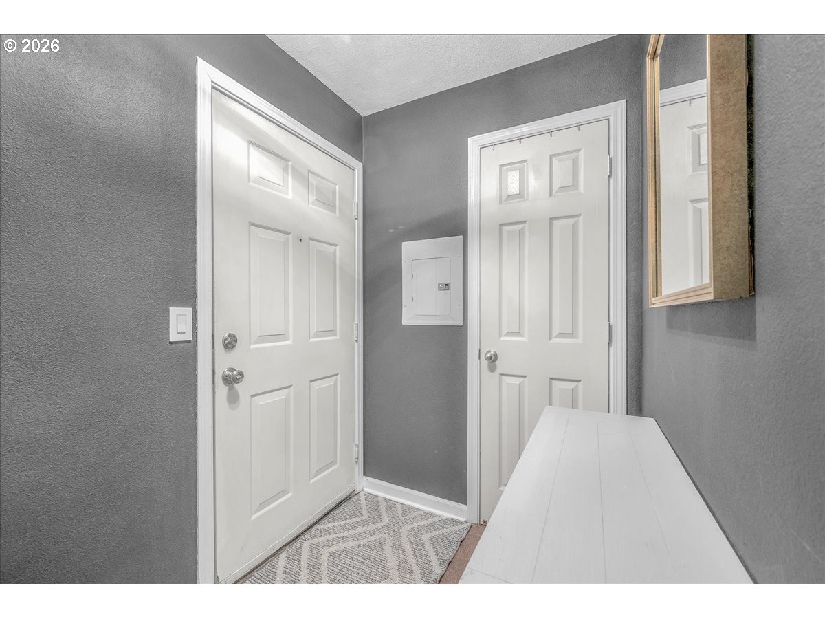 5142 Southwest Multnomah Boulevard, Unit H Portland, OR 97219 - Photo 6 of 26 a view of a hallway with wooden floor