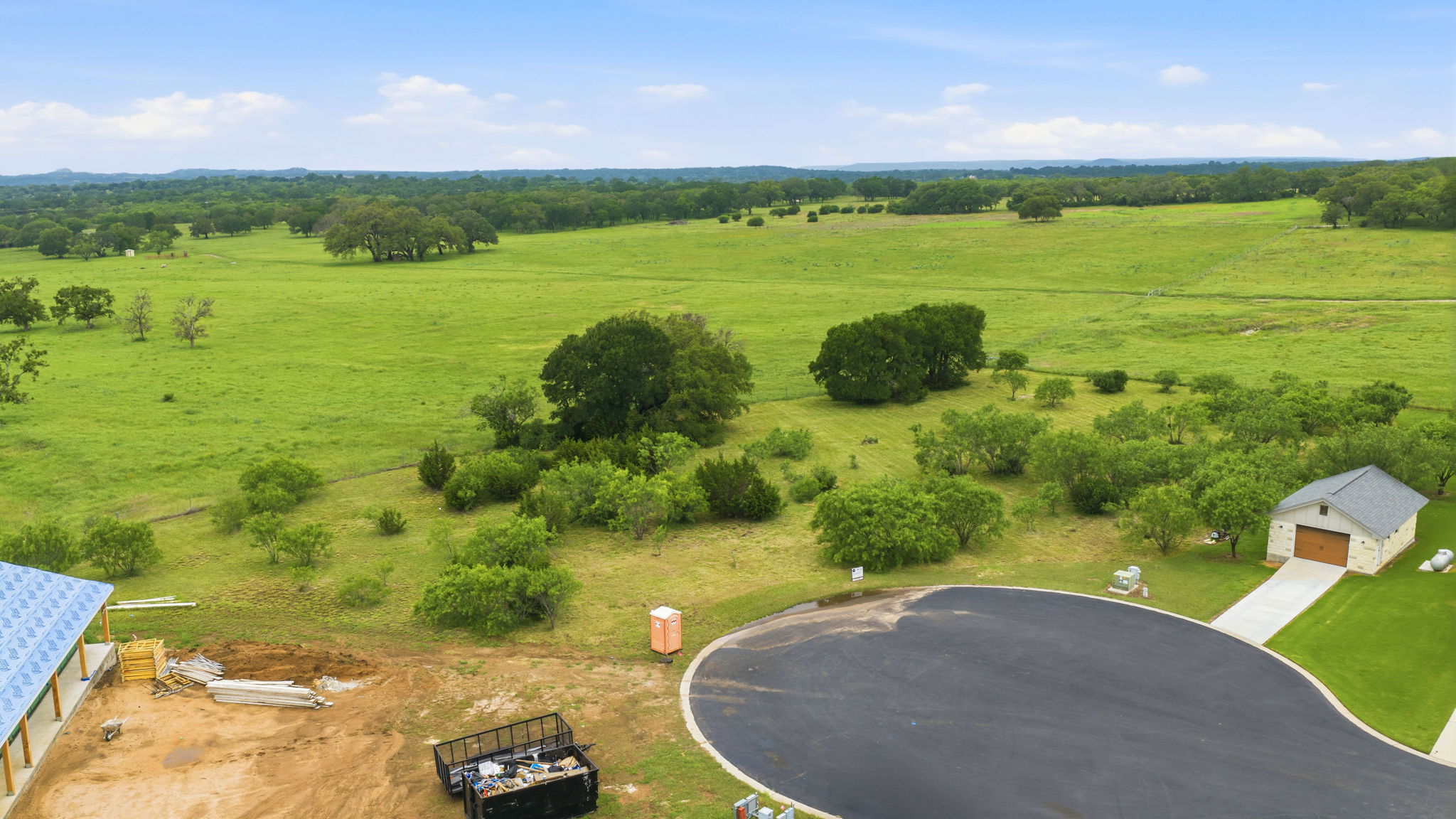 104 Round Up Circle Burnet, TX 78611 - Photo 23 of 23 Expansive green pastureland providing a scenic backdrop to development