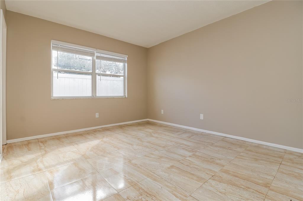 4173 Raccoon Loop New Port Richey, FL 34653 - Photo 9 of 16 an empty room with a window