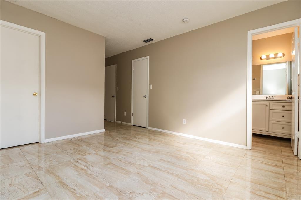 4173 Raccoon Loop New Port Richey, FL 34653 - Photo 10 of 16 a view of an empty room with window and a bathroom