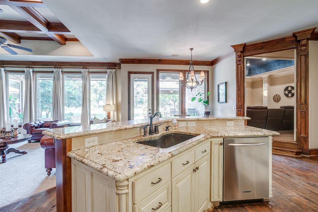 6251 Paper Shell Way Fort Worth, TX 76179 - Photo 11 of 40 a kitchen with granite countertop a sink and a stove