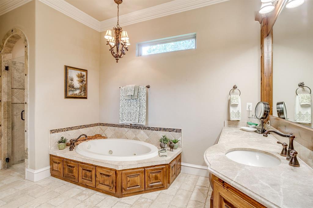 6251 Paper Shell Way Fort Worth, TX 76179 - Photo 16 of 40 a spacious bathroom with a granite countertop tub sink and mirror