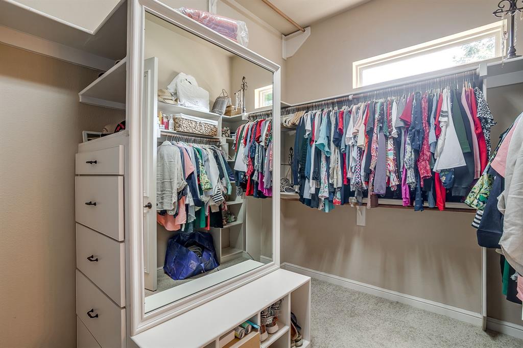 6251 Paper Shell Way Fort Worth, TX 76179 - Photo 19 of 40 a view of walk in closet with clothes and shoes