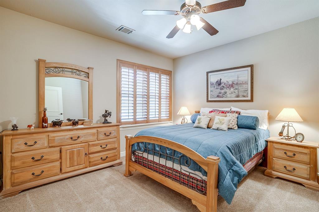 6251 Paper Shell Way Fort Worth, TX 76179 - Photo 20 of 40 a bedroom with a bed and a dresser