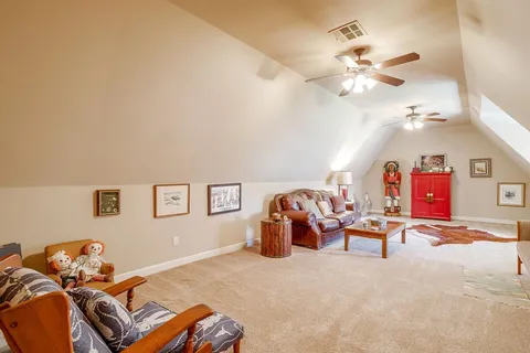 a bedroom with furniture and a chandelier