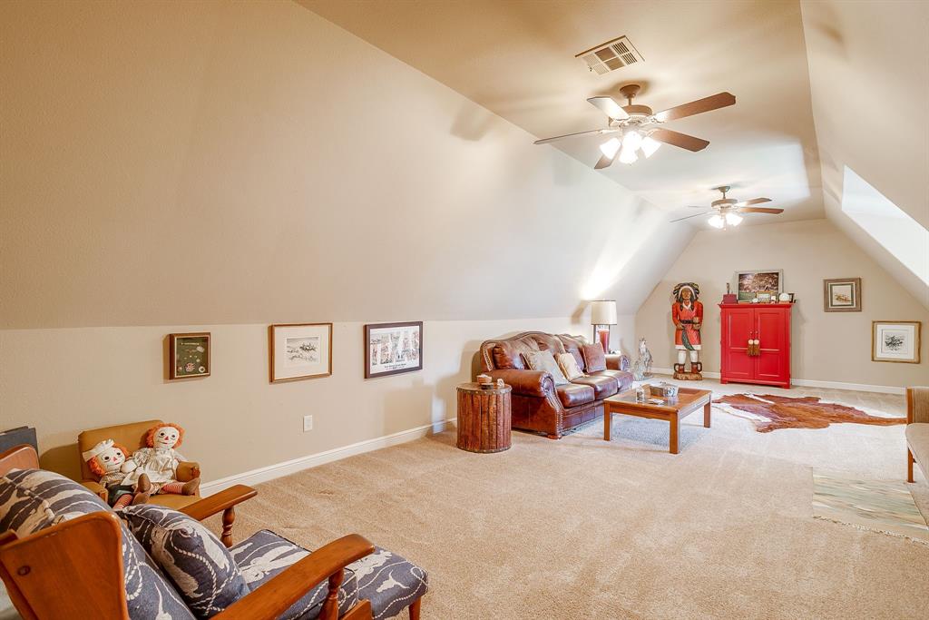6251 Paper Shell Way Fort Worth, TX 76179 - Photo 25 of 40 a bedroom with furniture and a chandelier