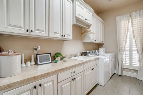 a kitchen with appliances cabinets and a counter top space
