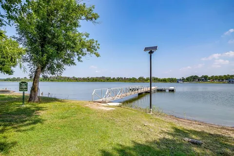 a view of a lake with a large trees
