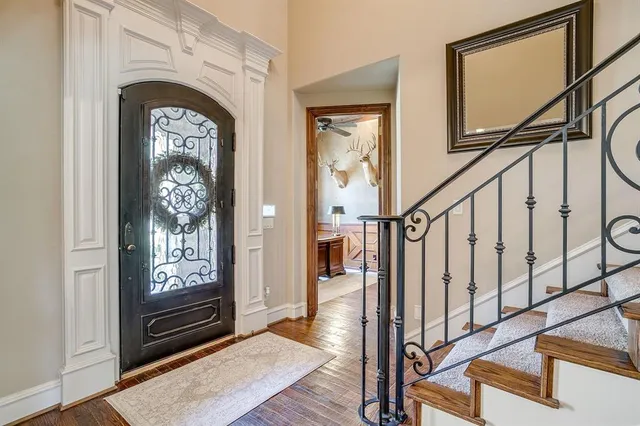 a view of front door with wooden floor