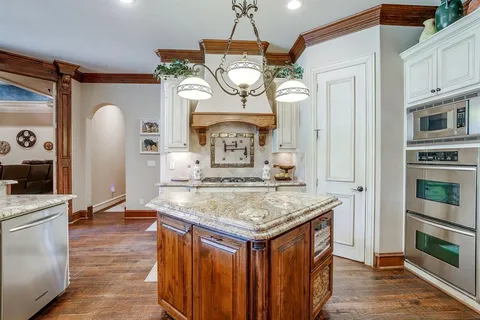 a view of kitchen island with wooden floor
