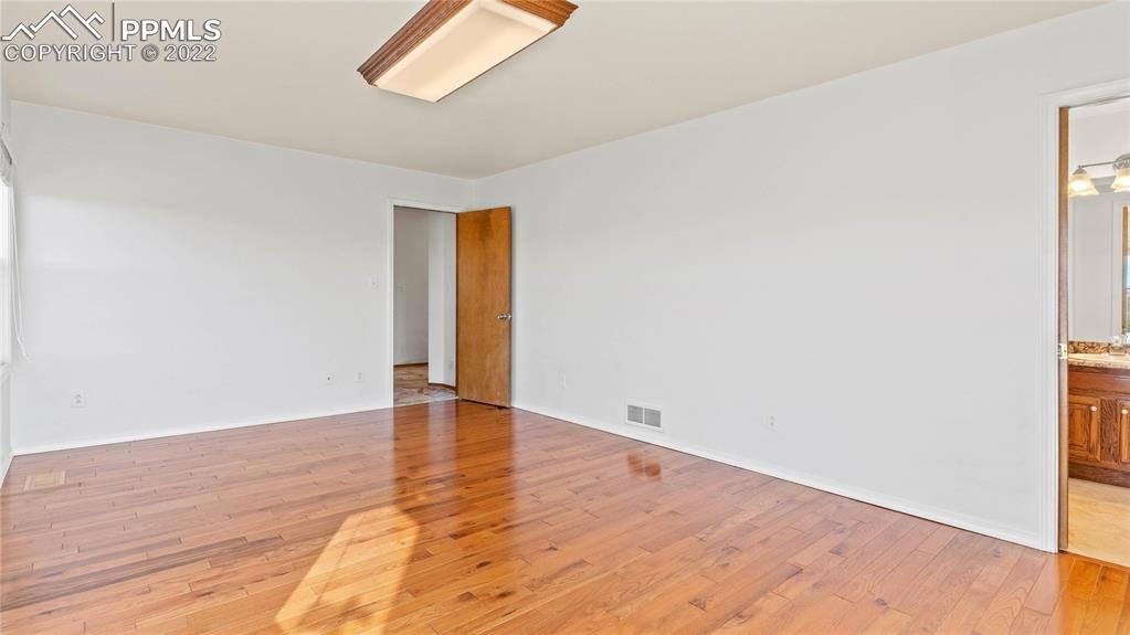 16250 Herring Road Colorado Springs, CO 80908 - Photo 17 of 50 a view of an empty room and wooden floor