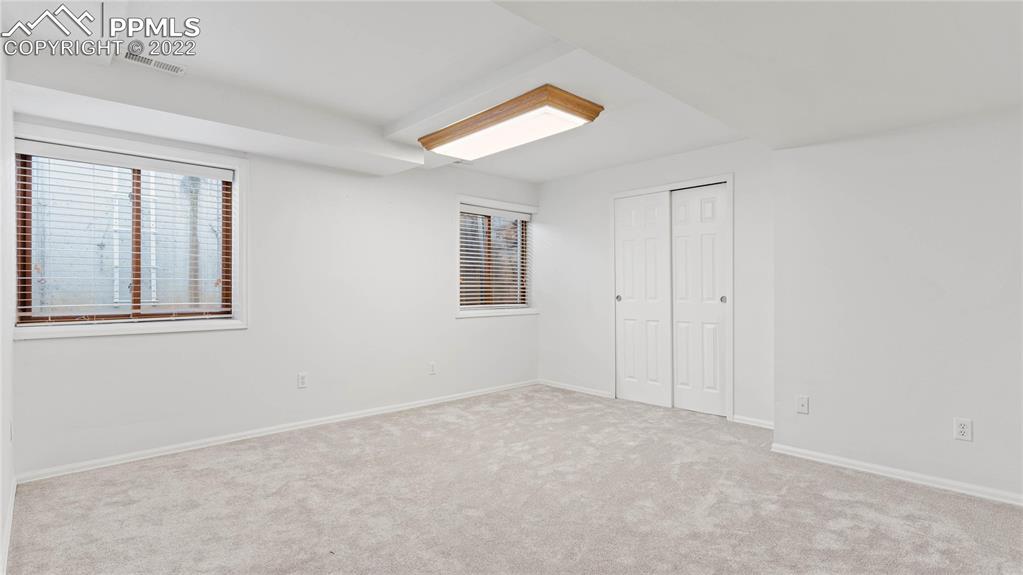 16250 Herring Road Colorado Springs, CO 80908 - Photo 38 of 50 an empty room with windows