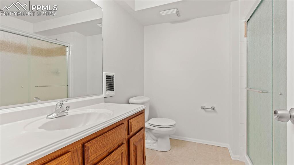 16250 Herring Road Colorado Springs, CO 80908 - Photo 39 of 50 a bathroom with a sink toilet and vanity