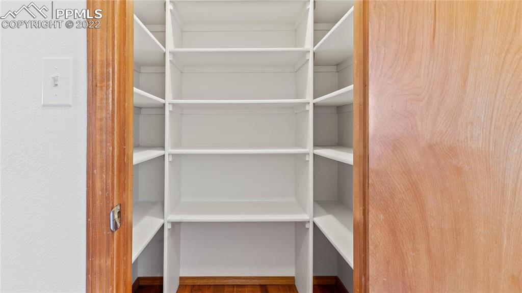 16250 Herring Road Colorado Springs, CO 80908 - Photo 8 of 50 a view of walk in closet with empty racks