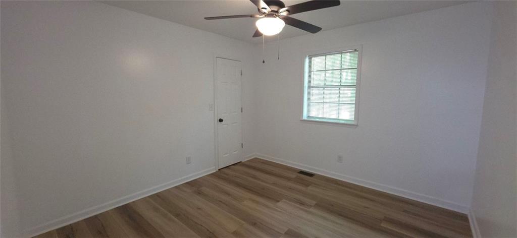 1774 Joe Black Road Sautee Nacoochee, GA 30571 - Photo 10 of 20 an empty room with a window and a fan