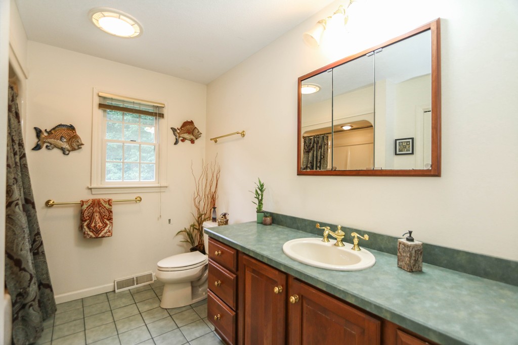12 Bellows Road Wilbraham, MA 01095 - Photo 23 of 30 a bathroom with a granite countertop sink mirror vanity and toilet