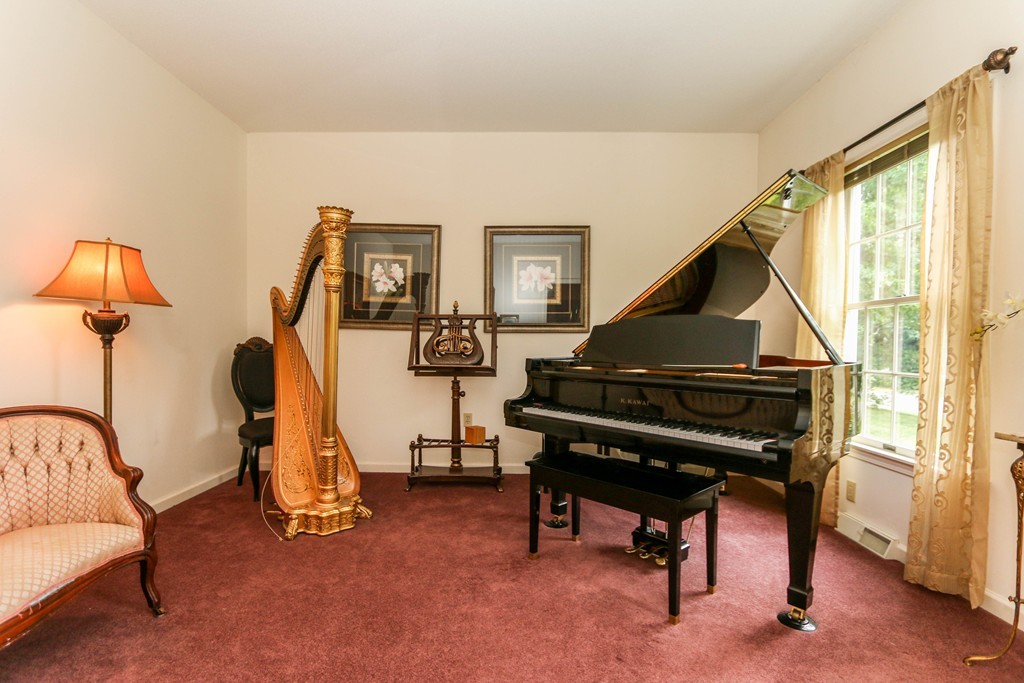 12 Bellows Road Wilbraham, MA 01095 - Photo 5 of 30 a living room with furniture a piano and a flat screen tv