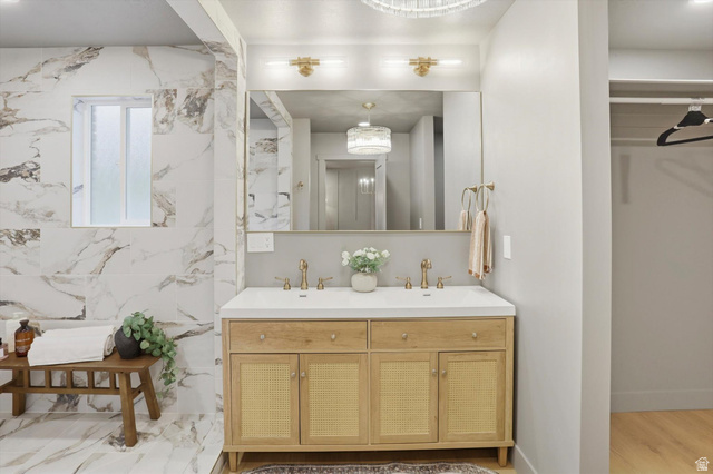 8760 Rustler Road Cottonwood Heights, UT 84093 - Photo 25 of 57 Dual vanity with wood-finish cabinetry and woven cane door panels