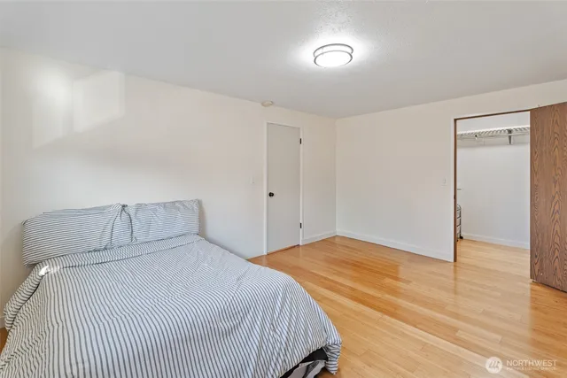 a bedroom with a bed and a table