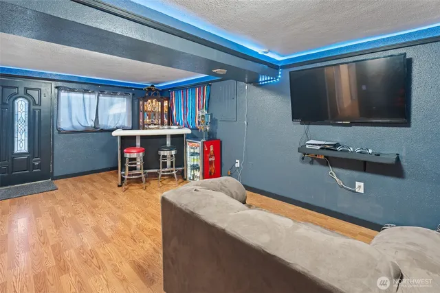 a room with furniture and a flat screen tv