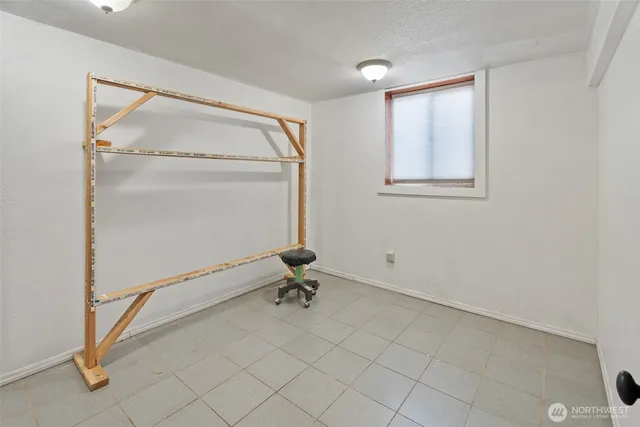 a room with a wooden floor and a window