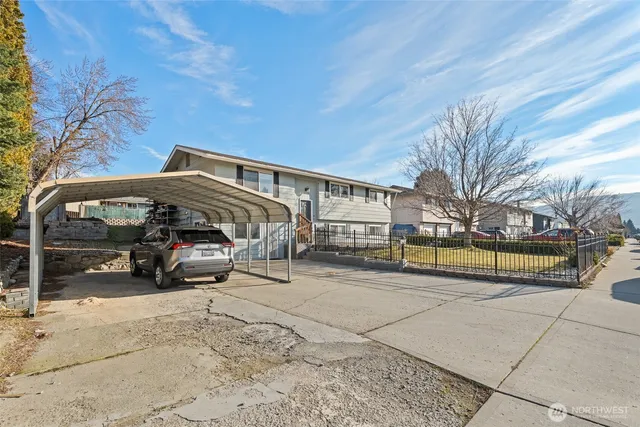 a view of garage and yard