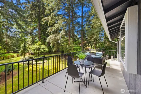 a view of balcony with furniture