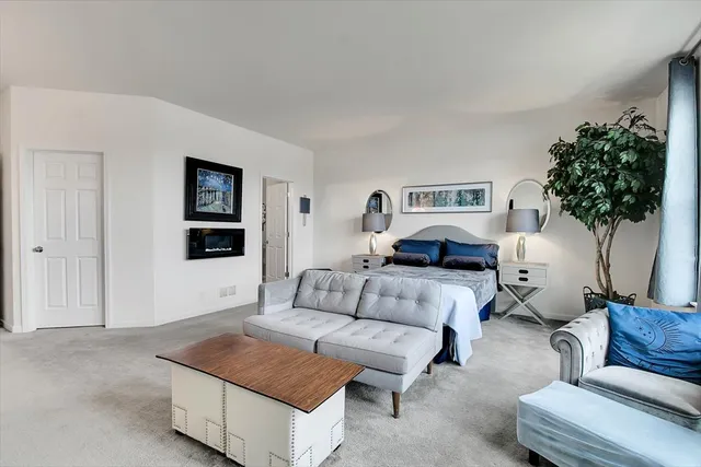 a bathroom with a sink a toilet a mirror and vanity