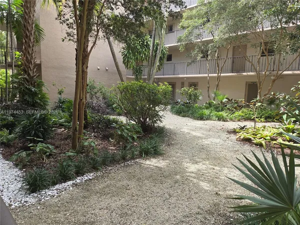 a view of a garden with pathway