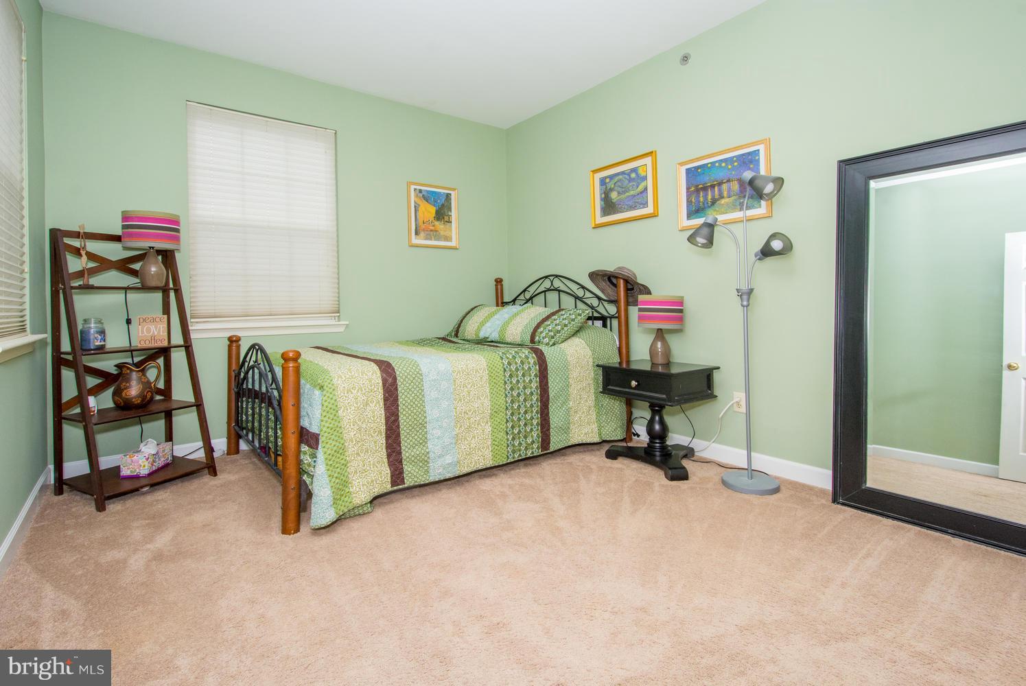 606 Moonglow Road, Unit 203 Odenton, MD 21113 - Photo 17 of 29 a living room with a bed furniture and a window