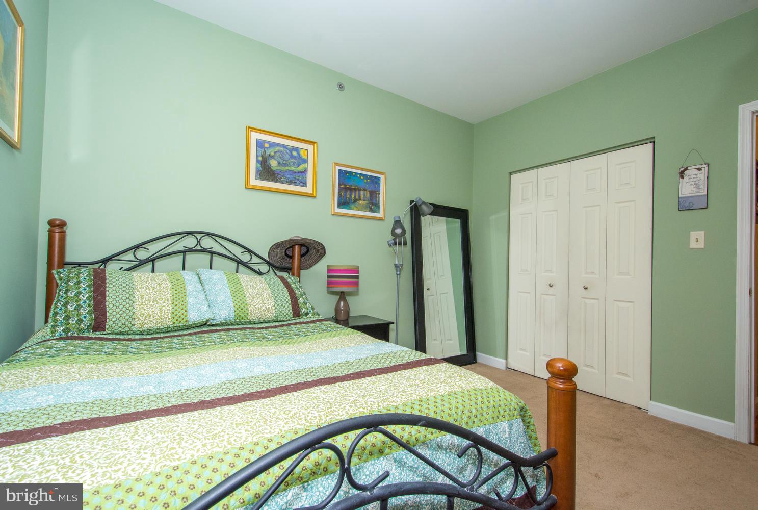 606 Moonglow Road, Unit 203 Odenton, MD 21113 - Photo 19 of 29 a bedroom with a bed and a dresser