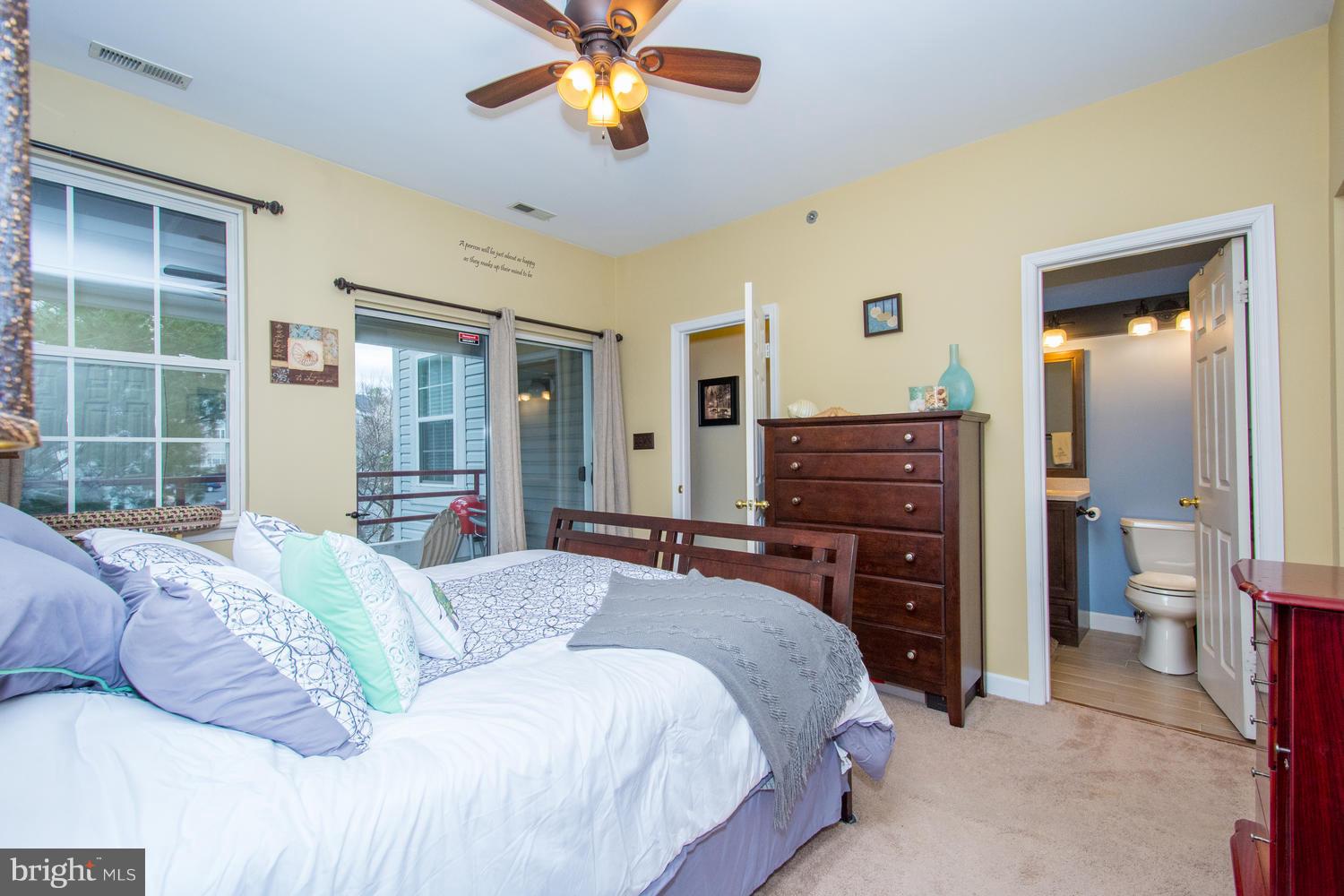 606 Moonglow Road, Unit 203 Odenton, MD 21113 - Photo 22 of 29 a bedroom with a bed and a chandelier