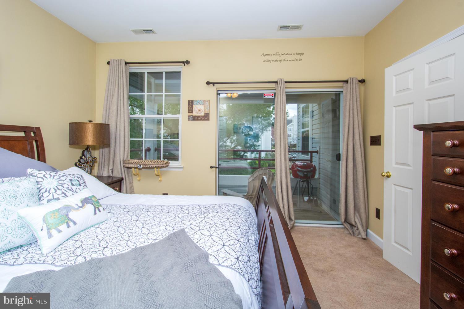 606 Moonglow Road, Unit 203 Odenton, MD 21113 - Photo 24 of 29 a bedroom with a large bed and a window
