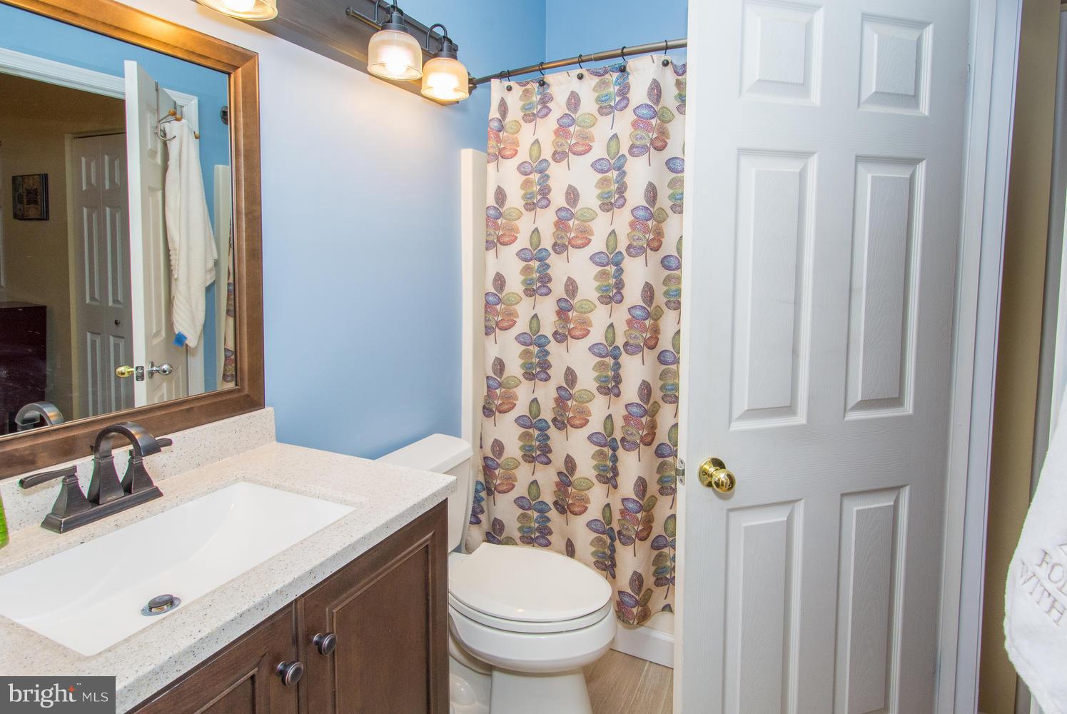 606 Moonglow Road, Unit 203 Odenton, MD 21113 - Photo 26 of 29 a bathroom with a sink toilet and shower