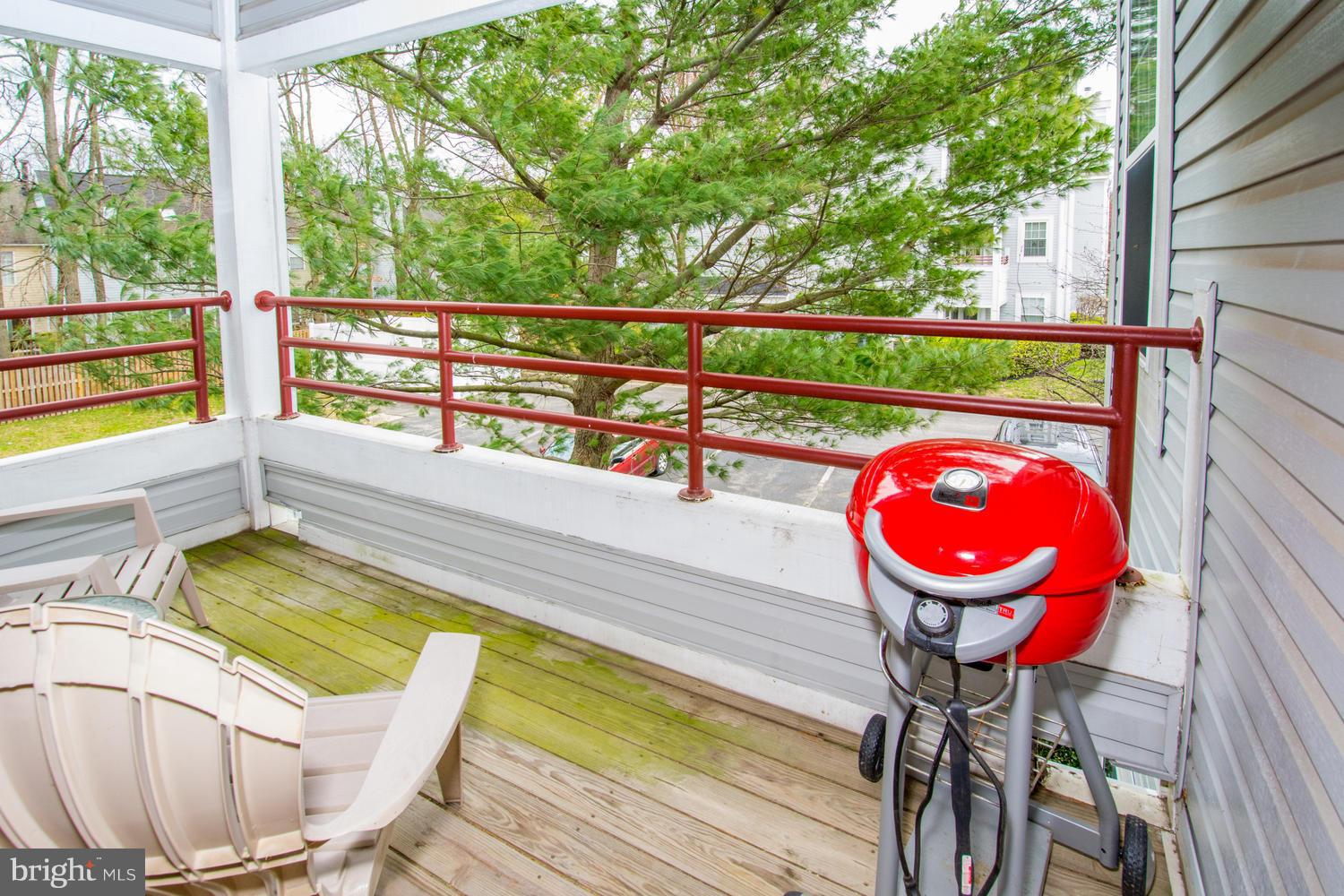 606 Moonglow Road, Unit 203 Odenton, MD 21113 - Photo 27 of 29 a view of a swimming pool with a lounge chairs