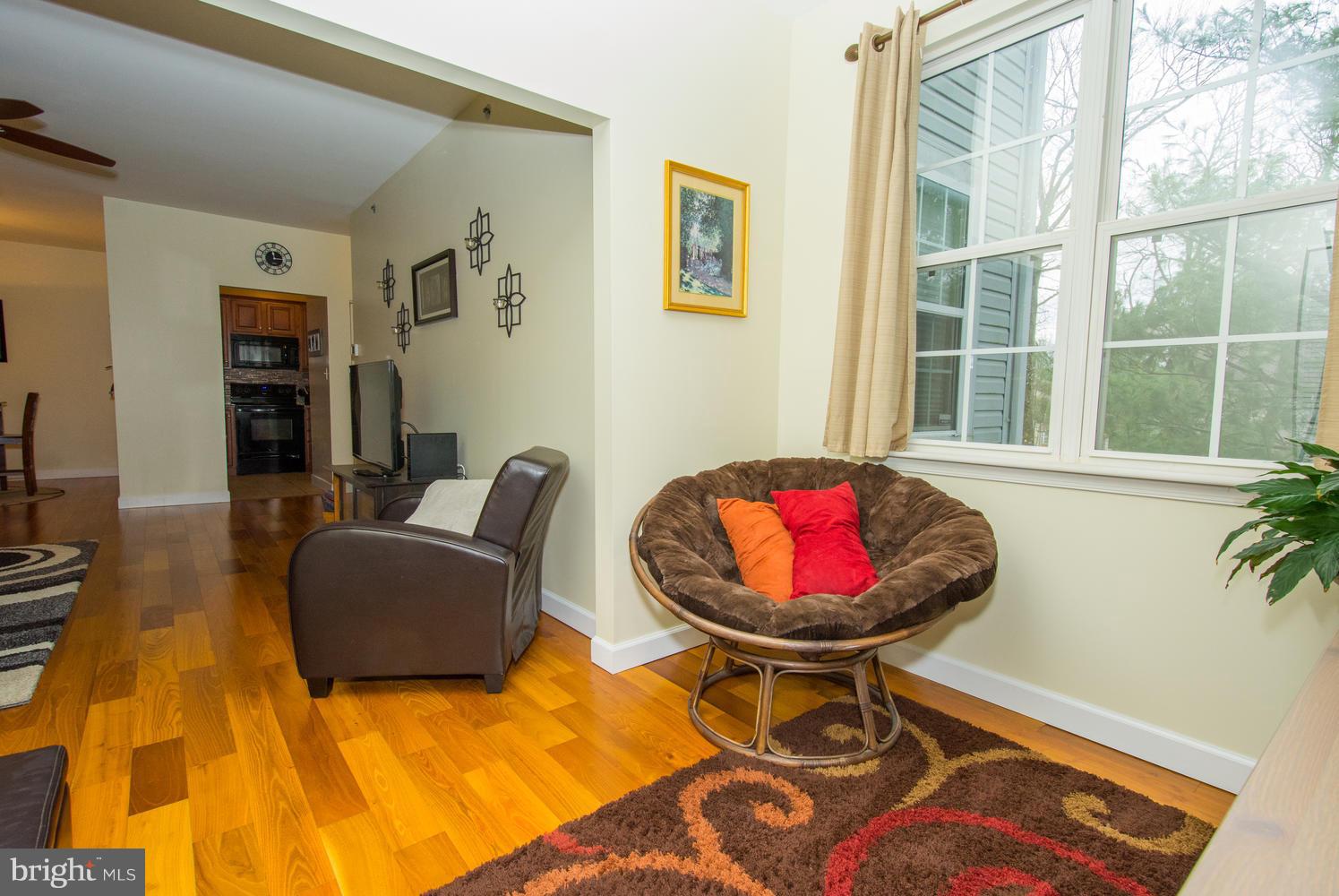 606 Moonglow Road, Unit 203 Odenton, MD 21113 - Photo 7 of 29 a living room with furniture and a window