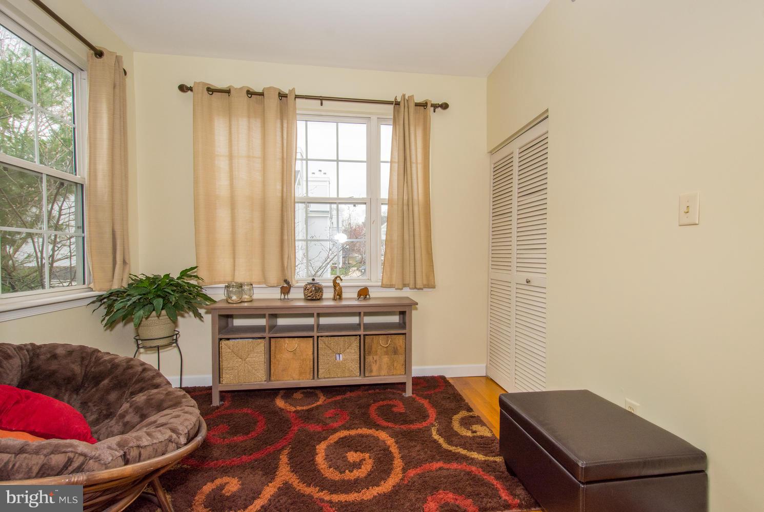 606 Moonglow Road, Unit 203 Odenton, MD 21113 - Photo 8 of 29 a living room with furniture and a potted plant