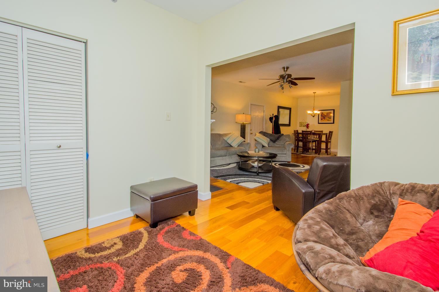 606 Moonglow Road, Unit 203 Odenton, MD 21113 - Photo 10 of 29 a bedroom with furniture and a wooden floor