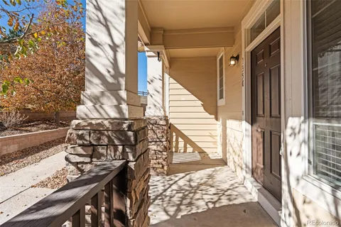 a view of balcony with wooden floor