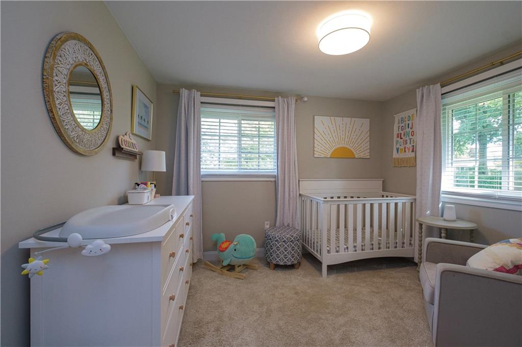 137 Easley Road Pittsburgh, PA 15237 - Photo 14 of 25 a room with a baby crib furniture a mirror and a window