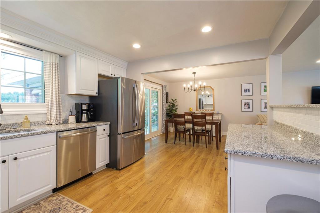137 Easley Road Pittsburgh, PA 15237 - Photo 6 of 25 a kitchen with refrigerator and chairs
