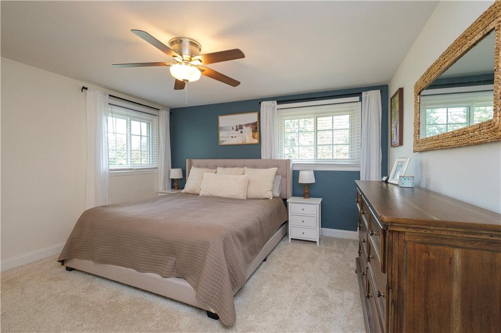 137 Easley Road Pittsburgh, PA 15237 - Photo 10 of 25 a bedroom with a large bed and windows